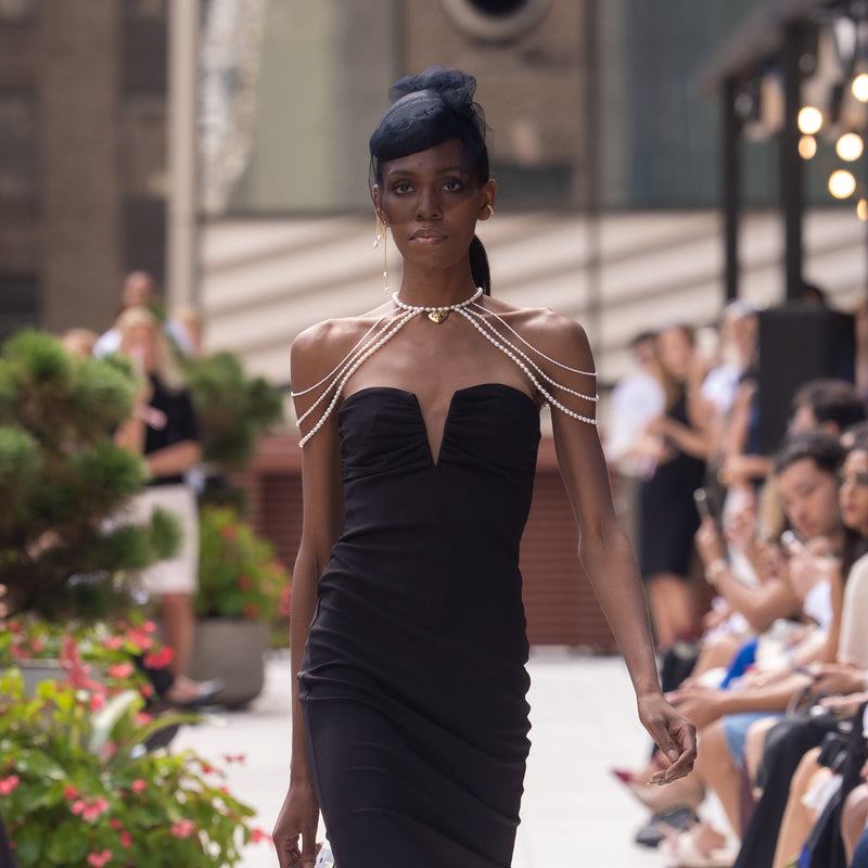Model wearing pearl shoulder piece at New York Fashion Week