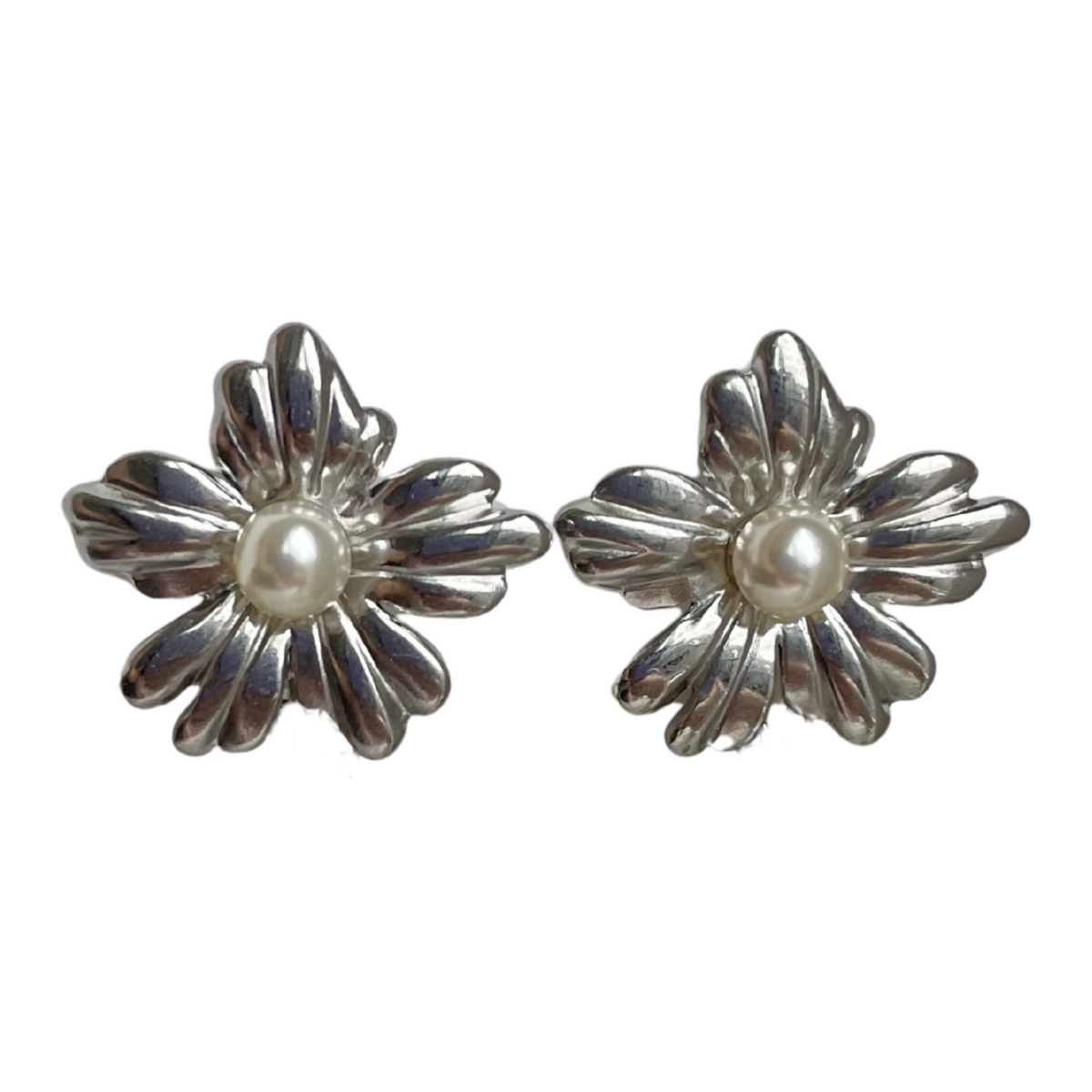 A pair of silver flower shaped stud earrings with pearl centres. 