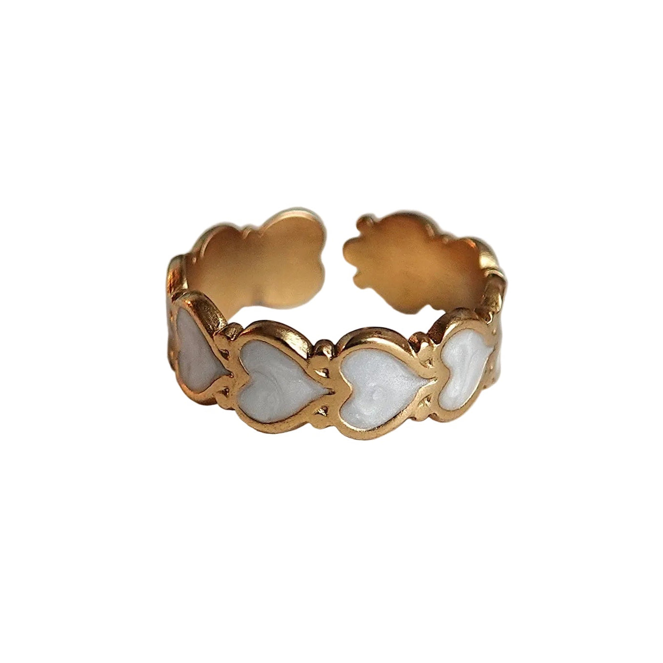 Gold ring with a white stone on a light gray background